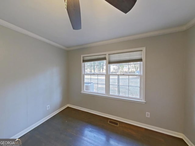 spare room featuring ceiling fan, crown molding, and dark hardwood / wood-style floors