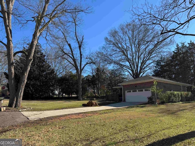 view of yard featuring a garage