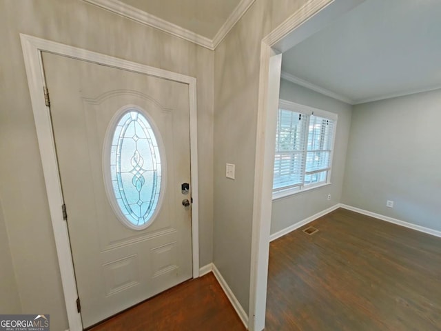 foyer featuring crown molding and dark hardwood / wood-style floors