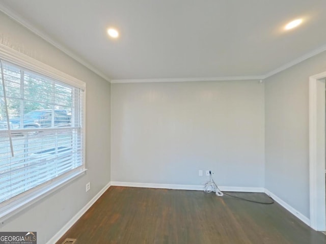 unfurnished room with dark wood-type flooring and crown molding