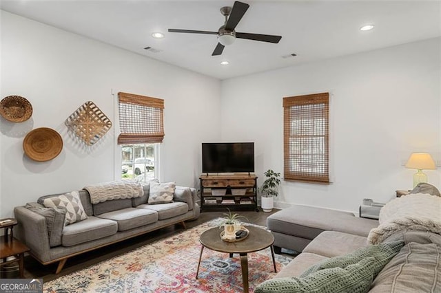 living room featuring wood finished floors, visible vents, and recessed lighting