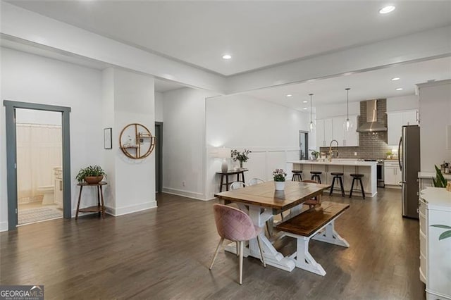 dining room with dark wood-style floors and recessed lighting