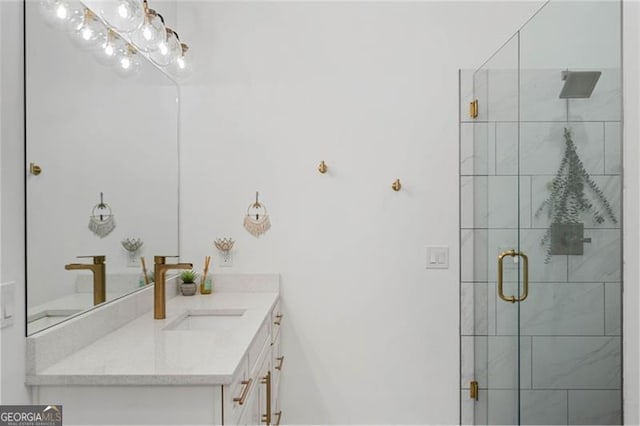 bathroom featuring a shower stall and vanity