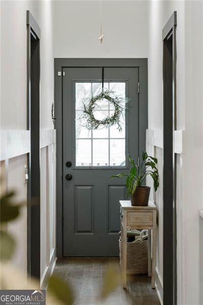 entryway with wood finished floors