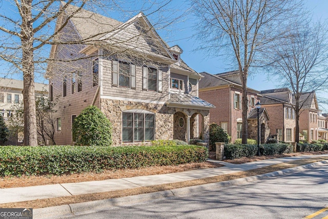 view of front of home featuring stone siding