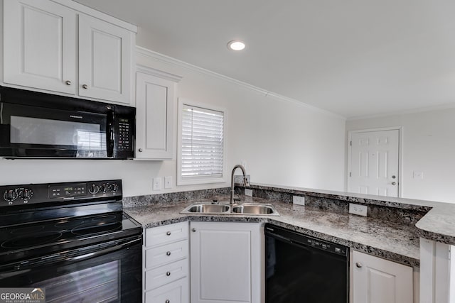 kitchen featuring white cabinetry, ornamental molding, sink, and black appliances