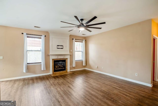 6498 Stonelake Pl SW, Atlanta, GA 30331 - unfurnished living room with ceiling fan, dark wood-type flooring, and plenty of natural light