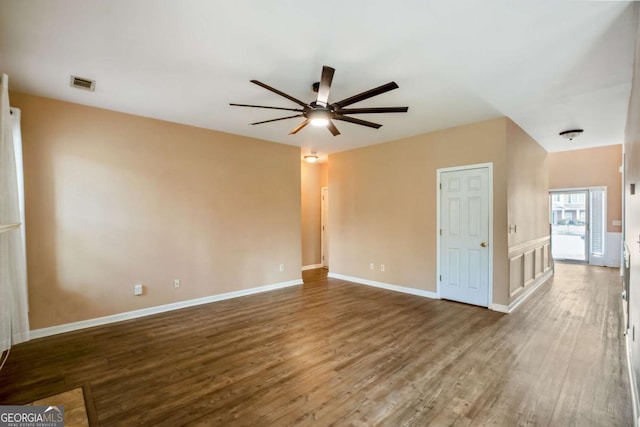 6498 Stonelake Pl SW, Atlanta, GA 30331 - empty room with wood finished floors, a ceiling fan, and baseboards