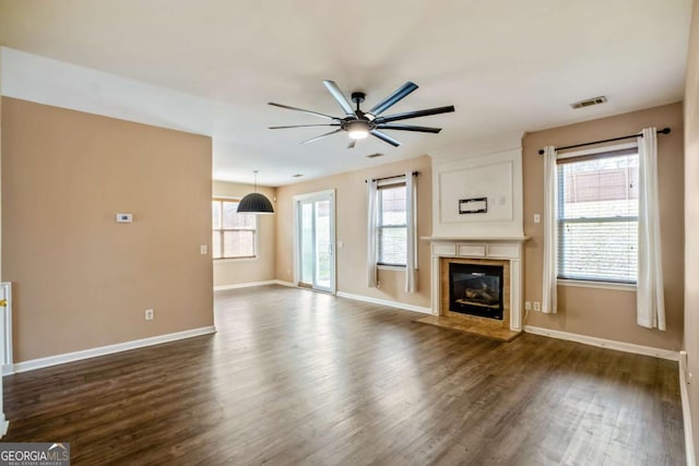 6498 Stonelake Pl SW, Atlanta, GA 30331 - unfurnished living room featuring a ceiling fan, dark wood finished floors, baseboards, and a fireplace