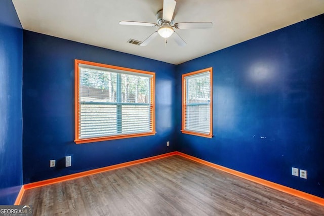 6498 Stonelake Pl SW, Atlanta, GA 30331 - unfurnished room with a ceiling fan, baseboards, and wood finished floors