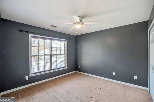 6498 Stonelake Pl SW, Atlanta, GA 30331 - empty room featuring a ceiling fan, baseboards, and carpet