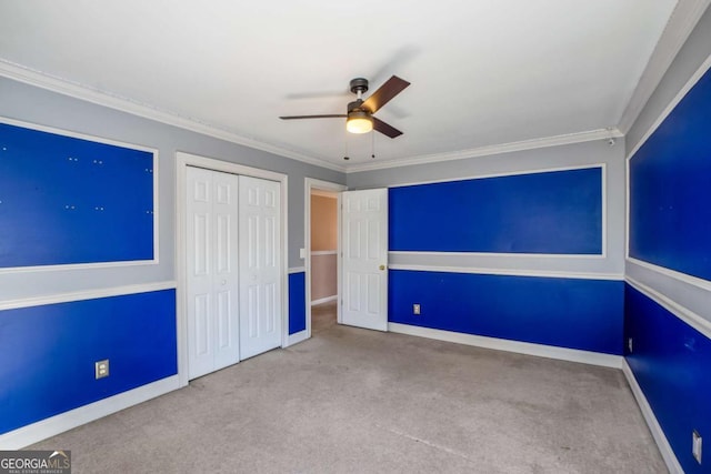 6498 Stonelake Pl SW, Atlanta, GA 30331 - unfurnished bedroom with carpet floors, a closet, baseboards, ceiling fan, and crown molding