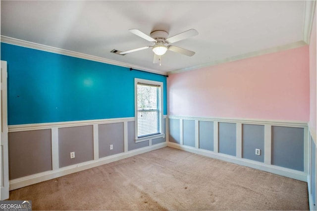 6498 Stonelake Pl SW, Atlanta, GA 30331 - unfurnished room with a ceiling fan, crown molding, wainscoting, carpet floors, and a decorative wall