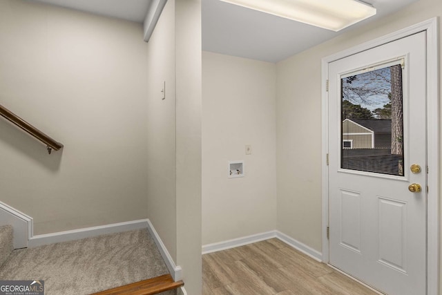 2542 Maclaren, Dunwoody, GA 30360 - washroom featuring washer hookup, light wood-style flooring, and baseboards