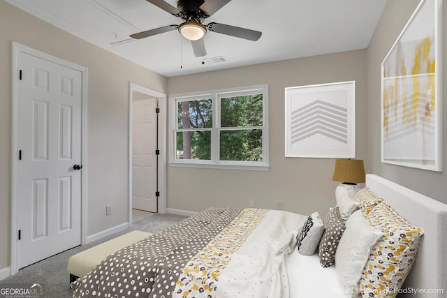 bedroom with baseboards, visible vents, ceiling fan, and light colored carpet