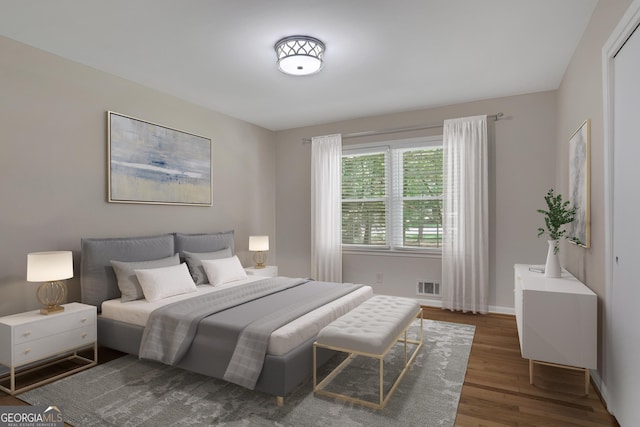 bedroom featuring dark wood-type flooring, visible vents, and baseboards