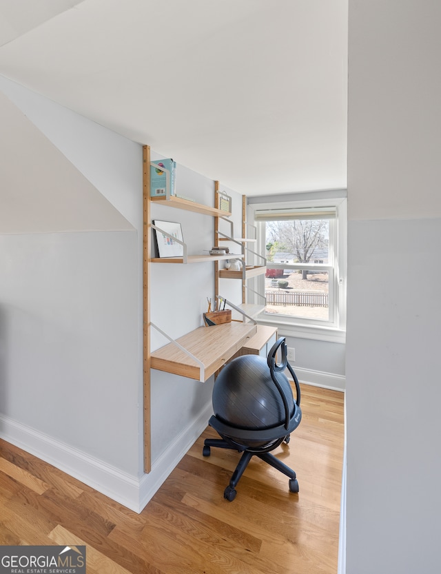 office with light wood finished floors and baseboards