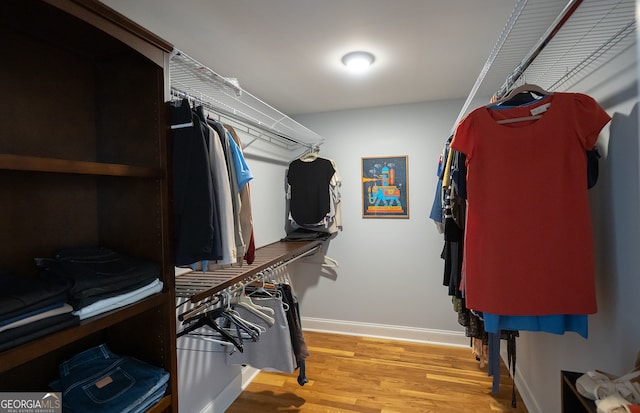 spacious closet with light wood-style flooring