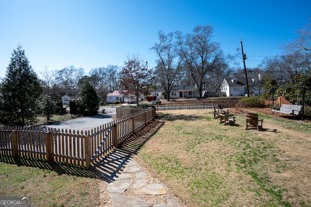 view of yard featuring a residential view and fence