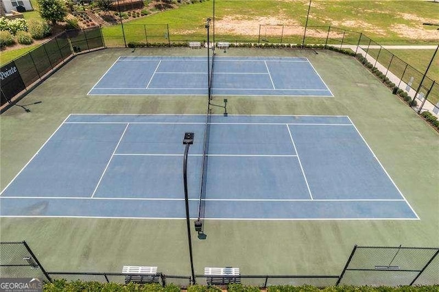 view of tennis court with fence