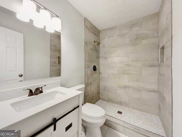 170 Pinehurst Dr, Stockbridge, GA 30281 - bathroom with vanity, tiled shower, and tile patterned flooring