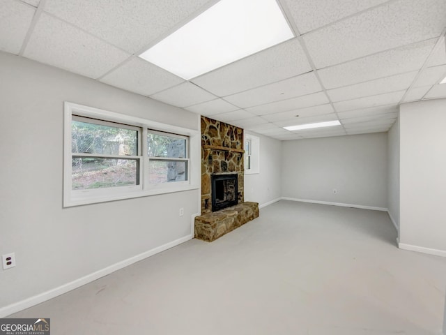170 Pinehurst Dr, Stockbridge, GA 30281 - unfurnished living room featuring a drop ceiling and a stone fireplace
