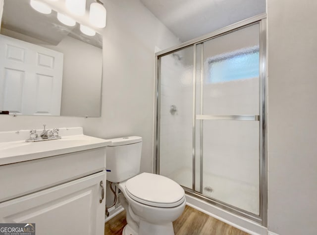 170 Pinehurst Dr, Stockbridge, GA 30281 - bathroom featuring wood finished floors, vanity, and a shower stall