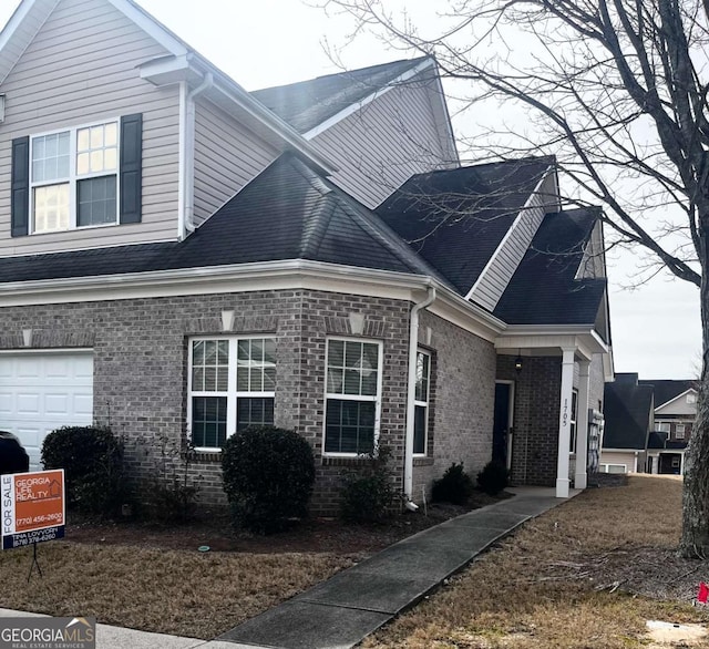 view of side of home with a garage