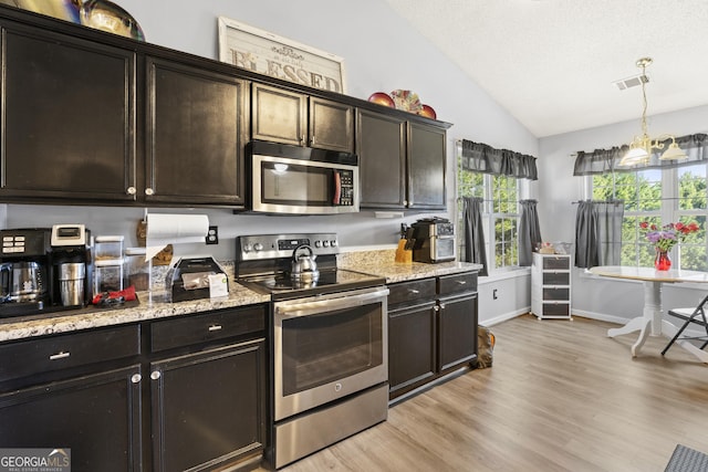 kitchen featuring lofted ceiling, stainless steel appliances, dark brown cabinetry, light hardwood / wood-style flooring, and light stone counters