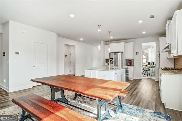 dining room featuring dark wood-type flooring