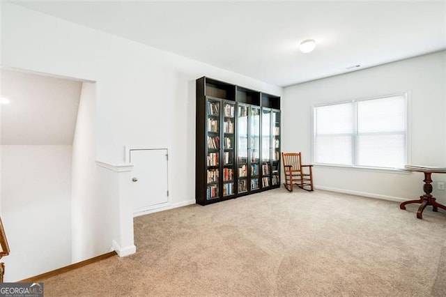 sitting room with light colored carpet