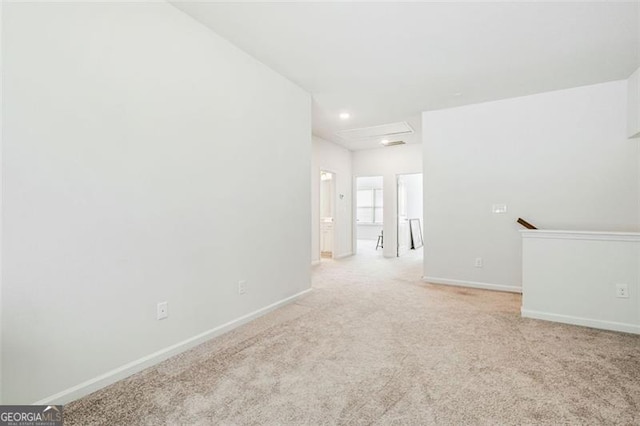 unfurnished room with light carpet