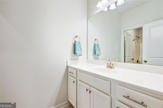 bathroom featuring vanity and a shower