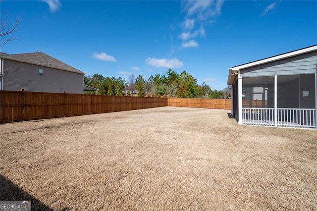 view of yard with a sunroom