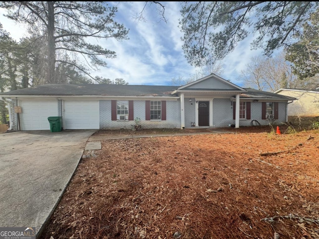 ranch-style house featuring a garage