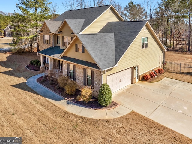 view of front of house featuring a front yard and a garage