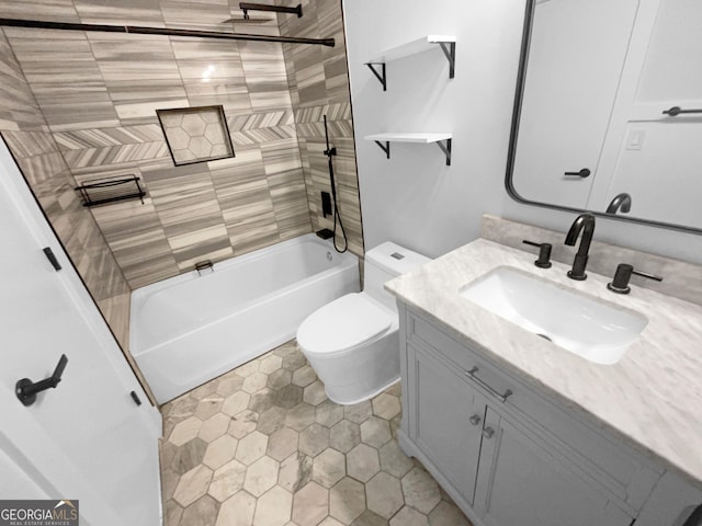full bathroom featuring toilet, vanity, and tiled shower / bath combo