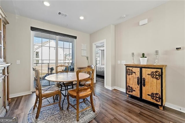 dining space featuring dark hardwood / wood-style flooring