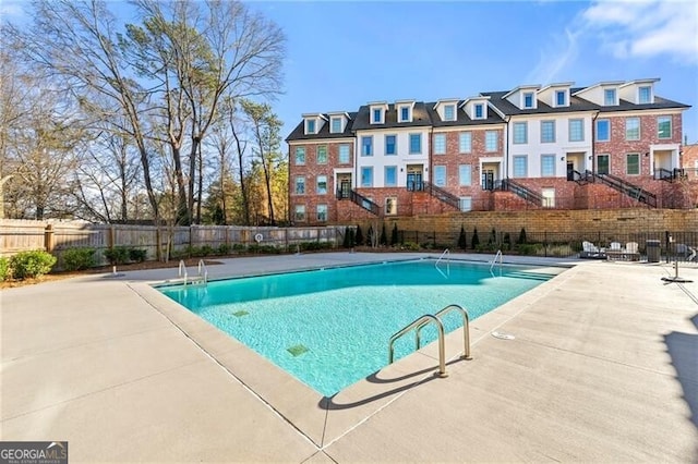 view of swimming pool with a patio area