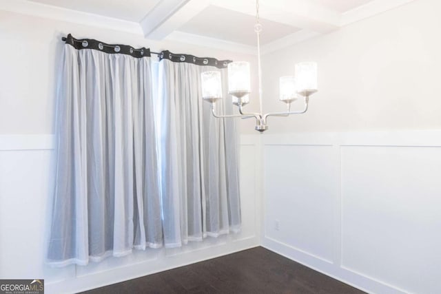 unfurnished dining area featuring an inviting chandelier, a decorative wall, beamed ceiling, and wainscoting