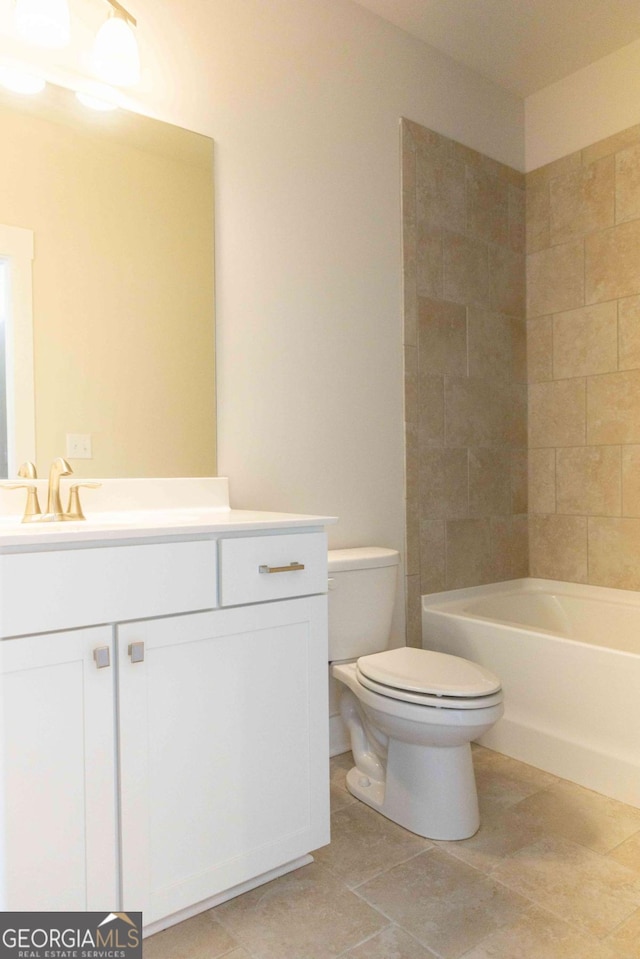 bathroom with vanity, toilet, and bathtub / shower combination