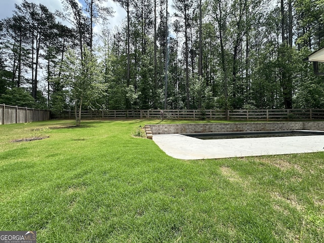 view of yard with a fenced backyard