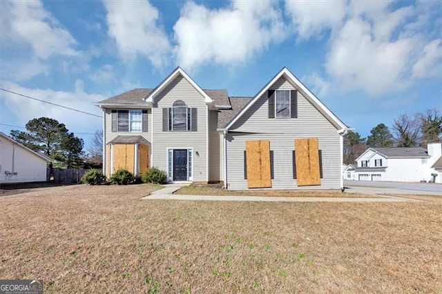 traditional-style house with a front lawn