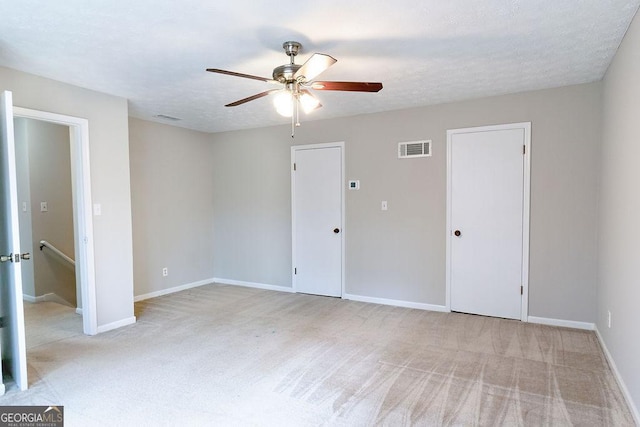 interior space featuring ceiling fan