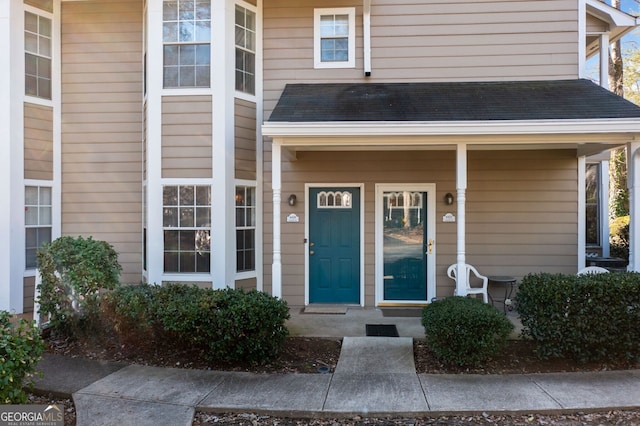 doorway to property with covered porch