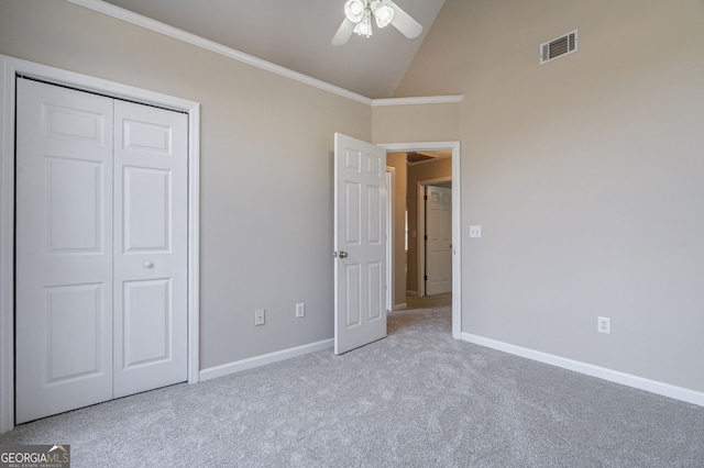 unfurnished bedroom featuring visible vents, crown molding, light carpet, and baseboards