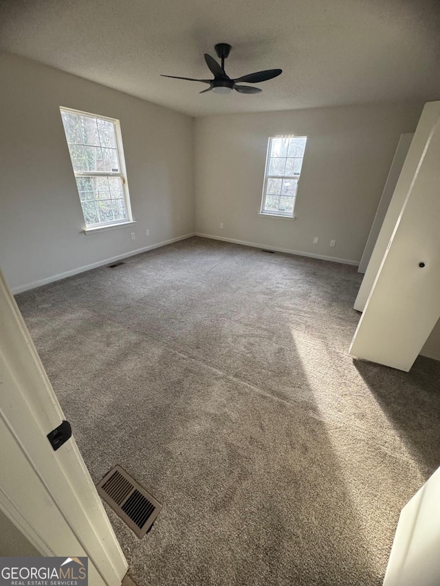 1753 Lee St, Decatur, GA 30035 - spare room with ceiling fan, carpet flooring, and a textured ceiling
