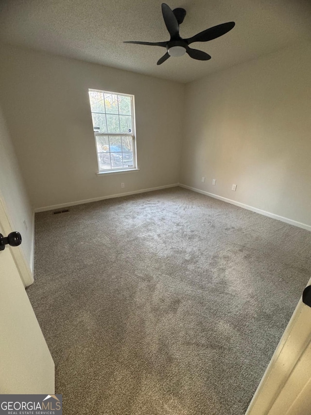 1753 Lee St, Decatur, GA 30035 - empty room featuring a textured ceiling, carpet, and ceiling fan