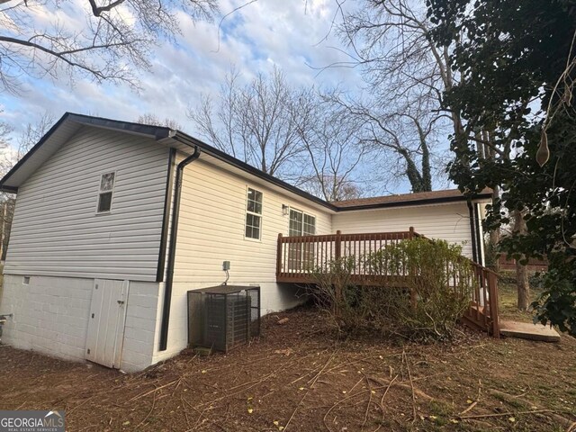 1753 Lee St, Decatur, GA 30035 - view of side of home with cooling unit and a wooden deck