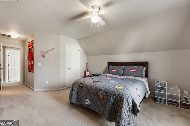 bedroom featuring lofted ceiling, ceiling fan, carpet floors, visible vents, and baseboards